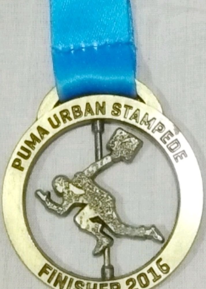 Collectible PUMA Urban Stampede Finisher Medal.