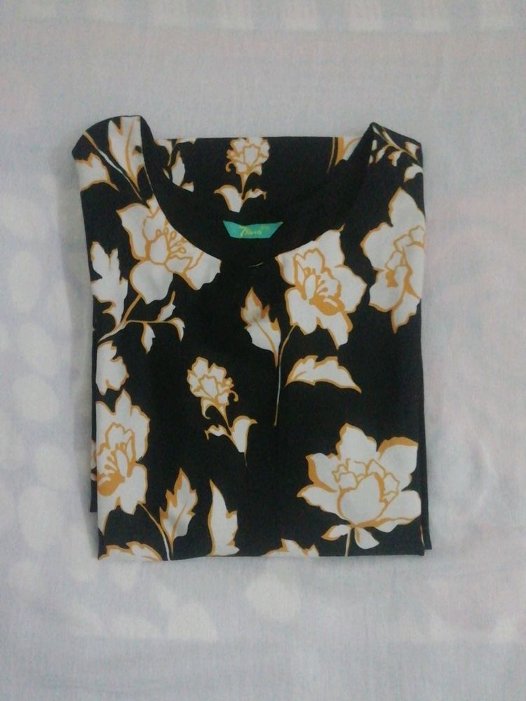 Black Crape Kurtha With  Yellow Border At Front.have White Flowers In It. Round Neck With 3/4 th Sleevs