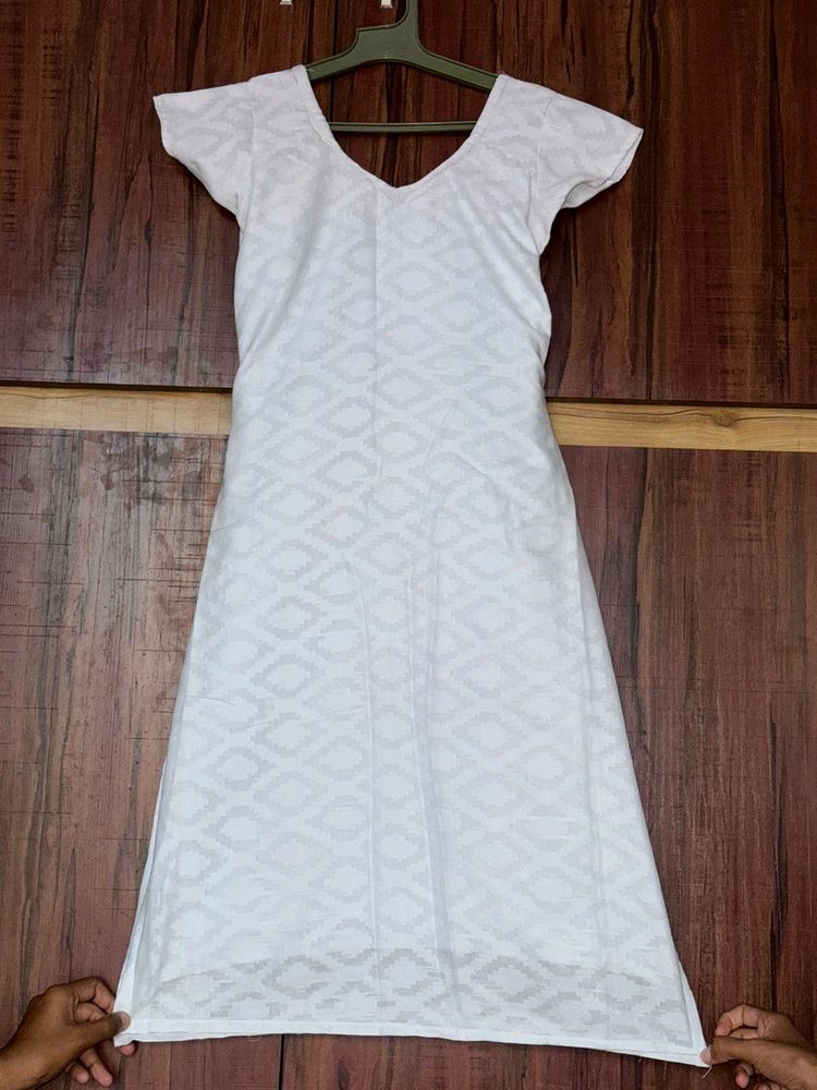 Printed white coloured Kurti.