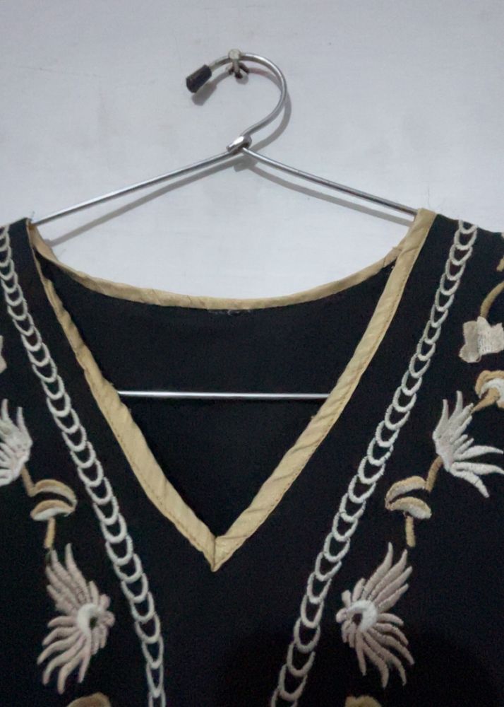a black embroidery crop top