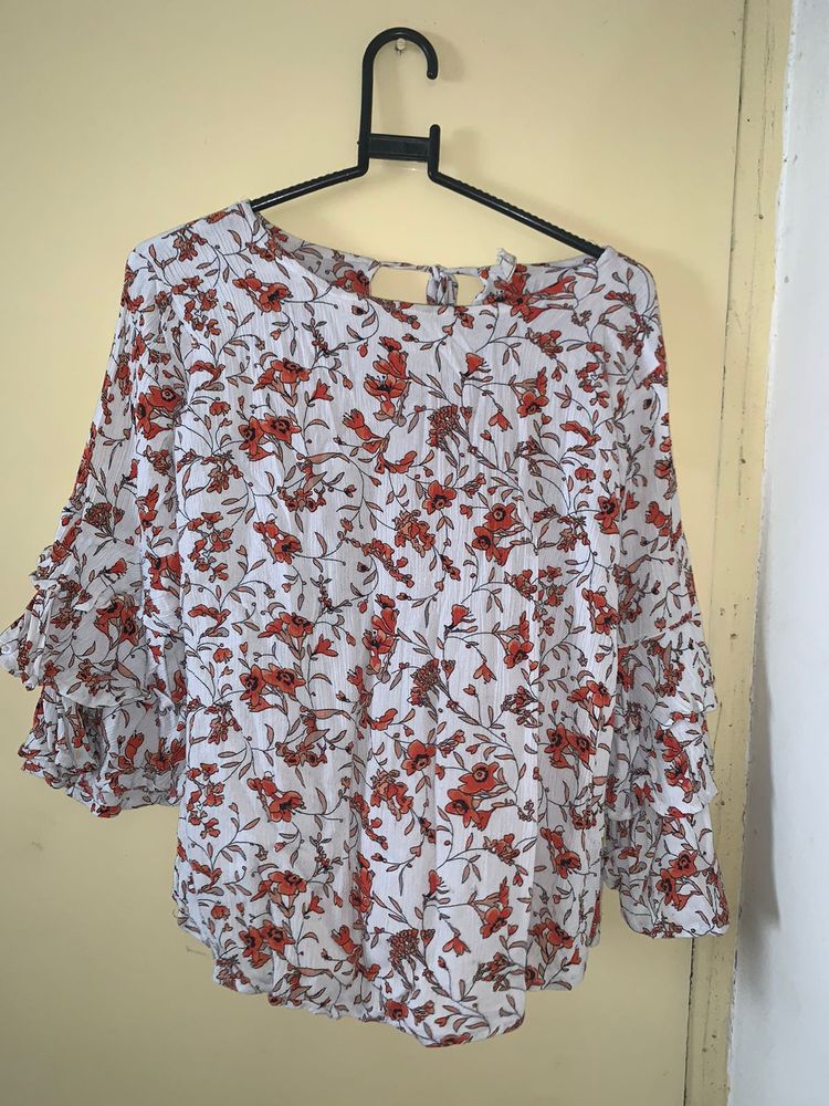 white and orange floral top