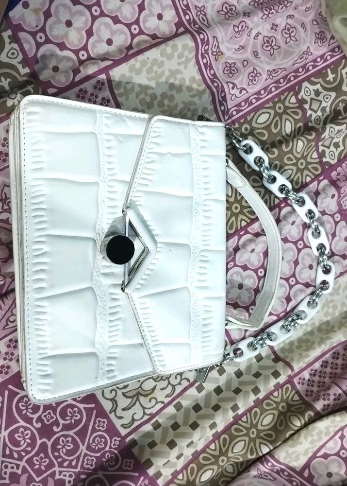 white hand purse