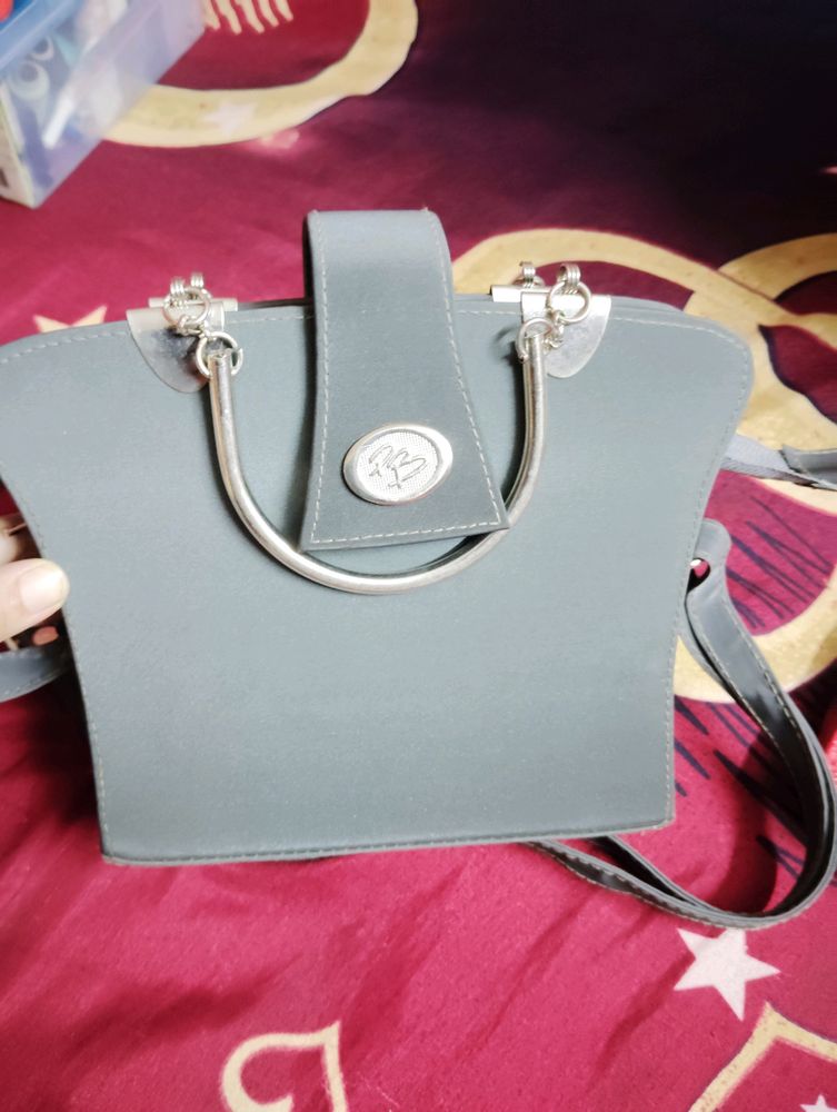 Grey Colour Handbag With Metal Handle