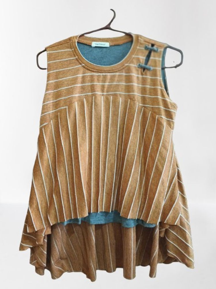 Sleevless Tunic With An Assymatrical Hem