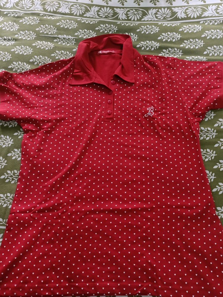 A Red Polo T Shirt For Women In Size XL.