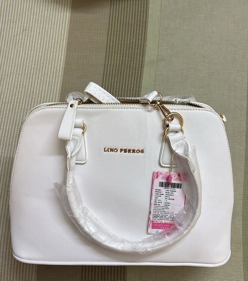 white hand bag