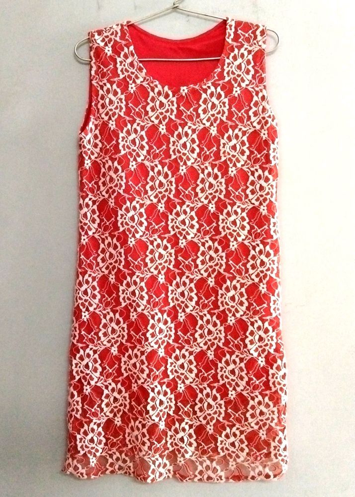 Beautiful Orange Sleeveless Tunic With White Flower Print On It..❤️