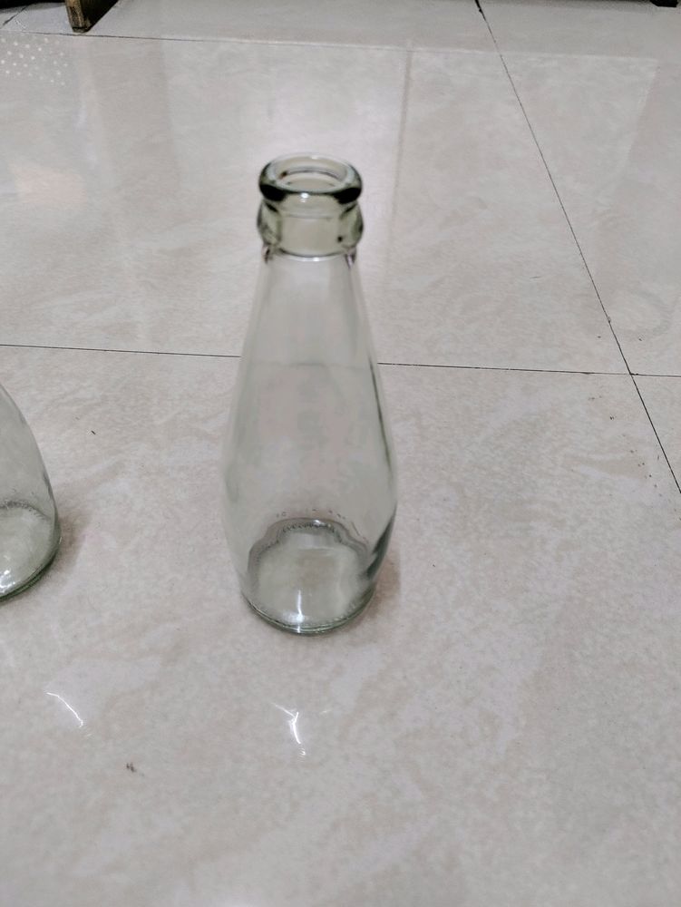 7 Empty Glass Bottles