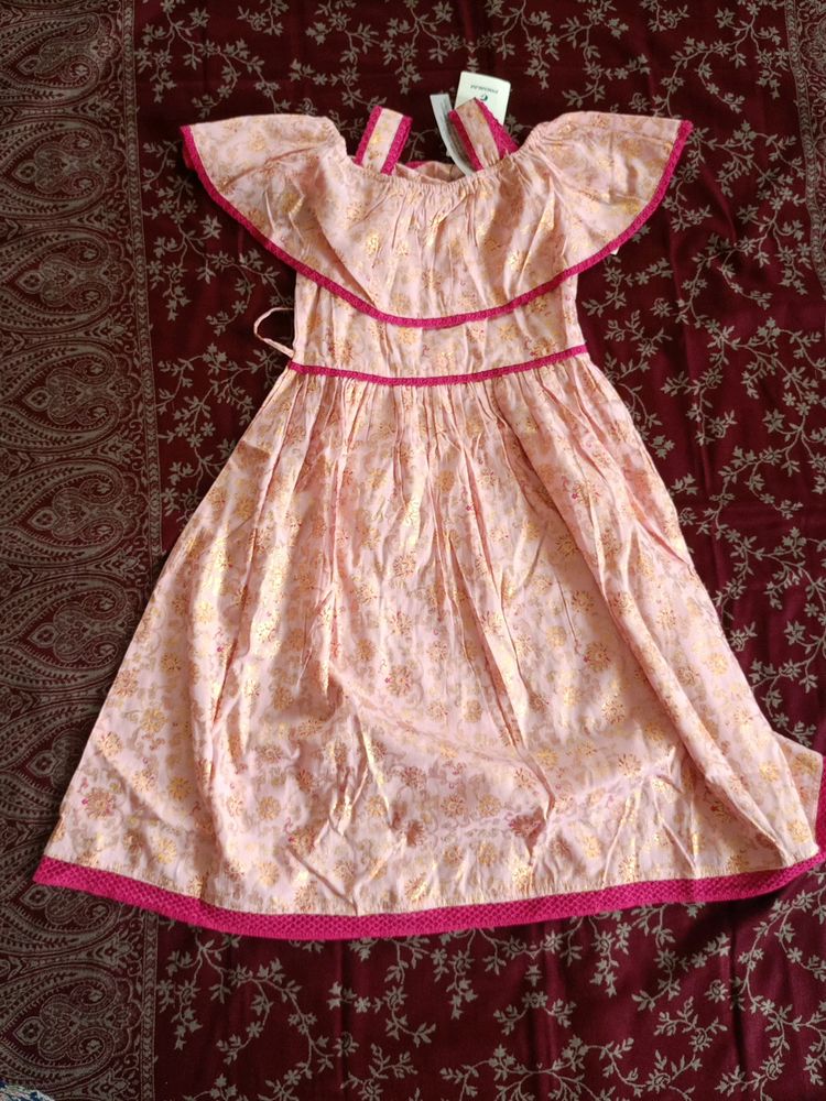 Baby Pink Frock With Gold Prints In It