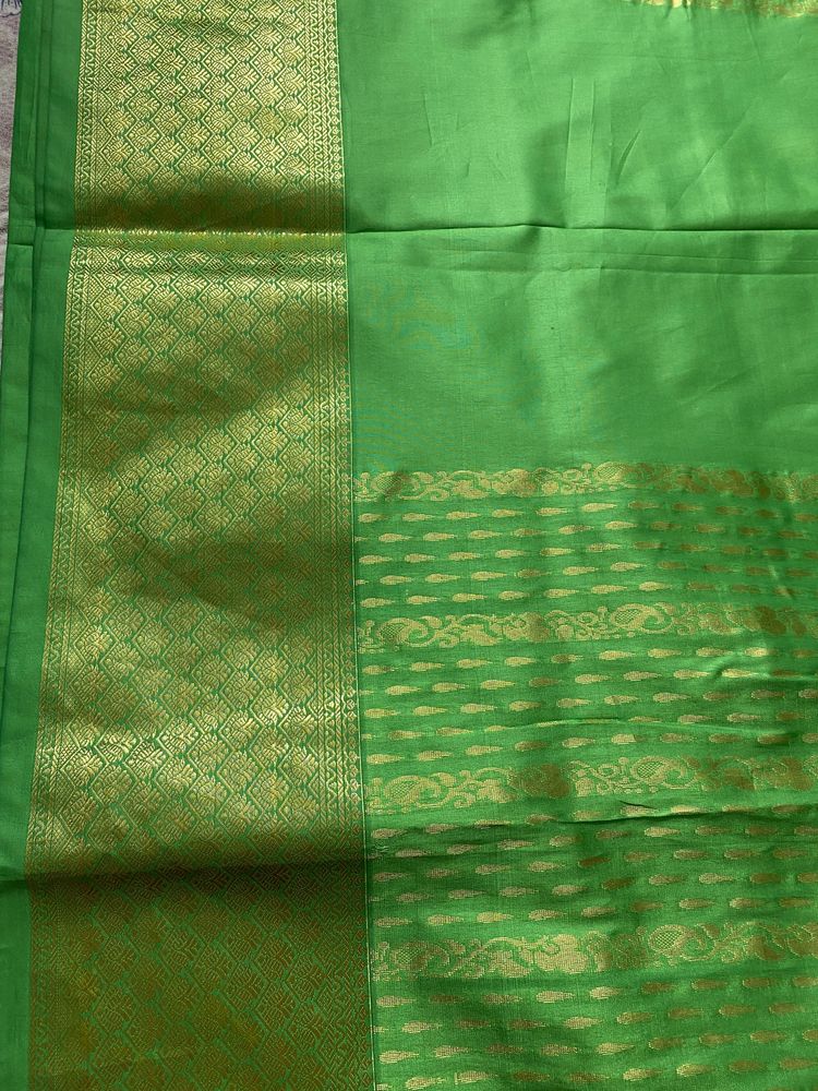 Green saree without blouse with zaree work