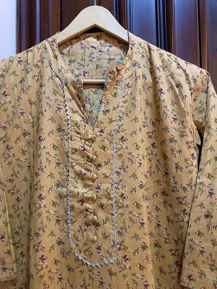 Yellow kurta with a delicate, small floral Print.