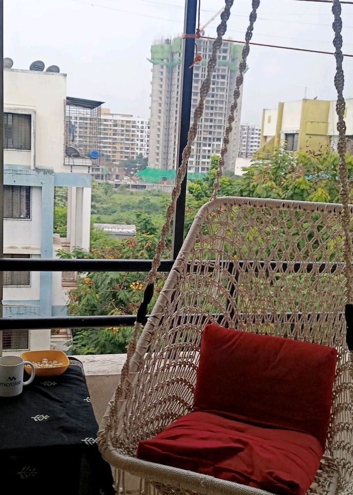 For Sale: Stylish Swing with Plush Red Cushion