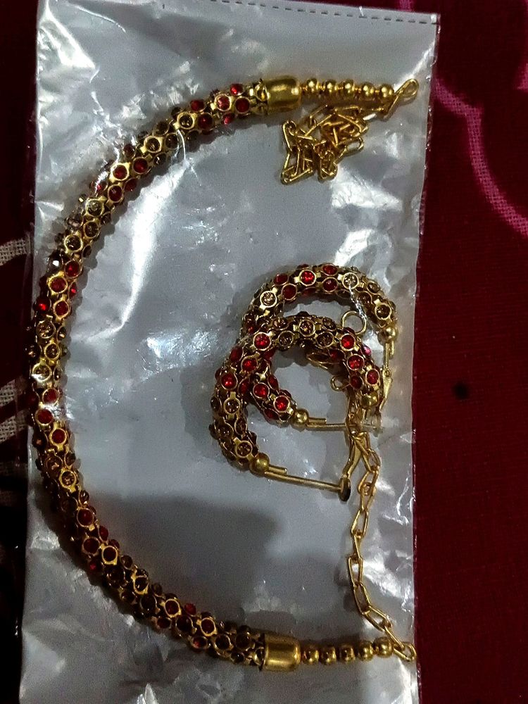 Red- Golden Neck Piece And Earrings