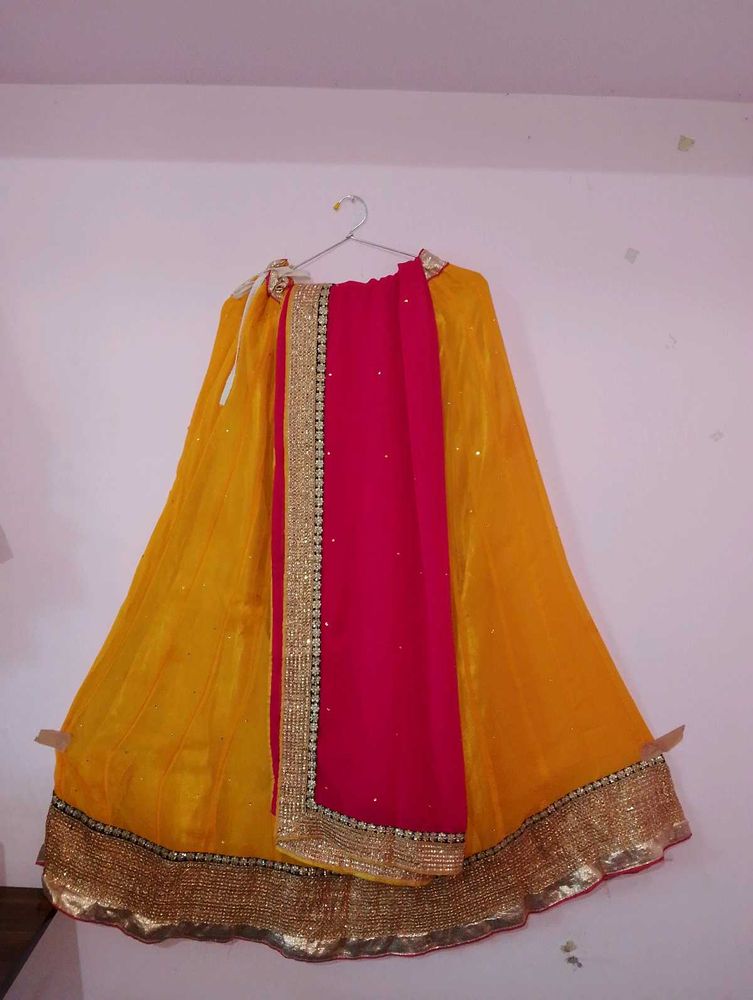 Rich Gold border Yellow lehenga with Pink dupatta