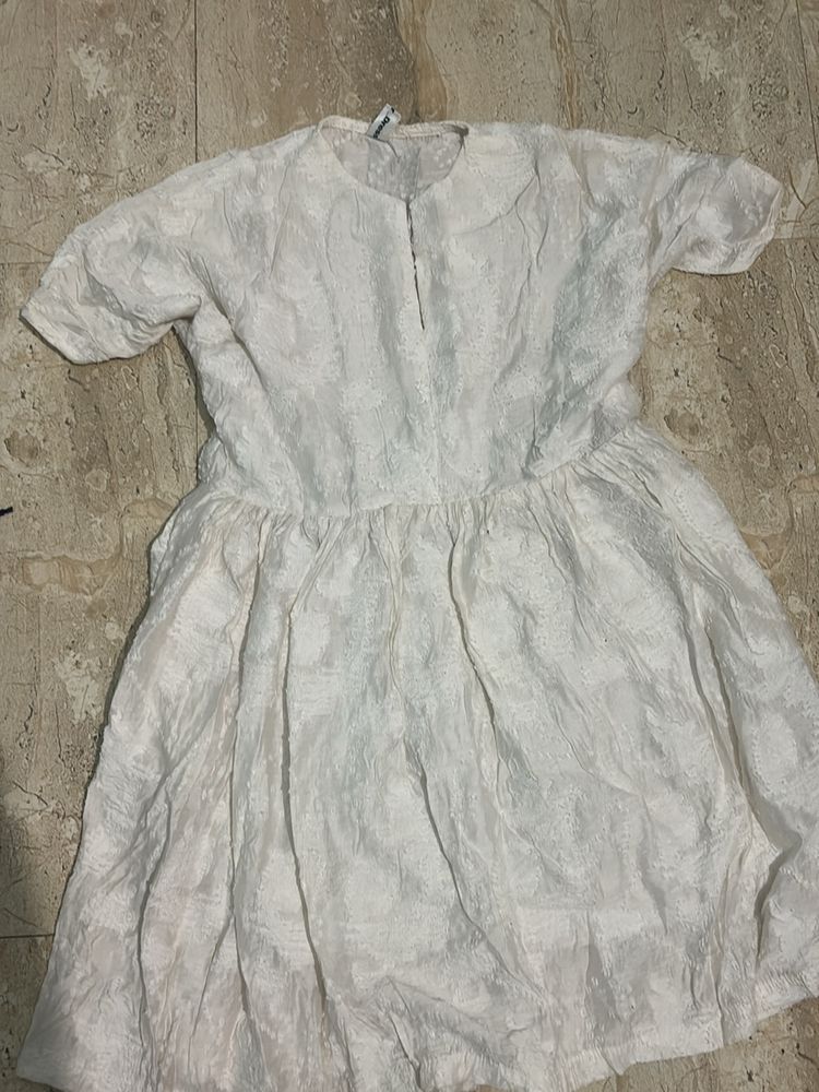 Vintage White Dress with Textured Fabric.