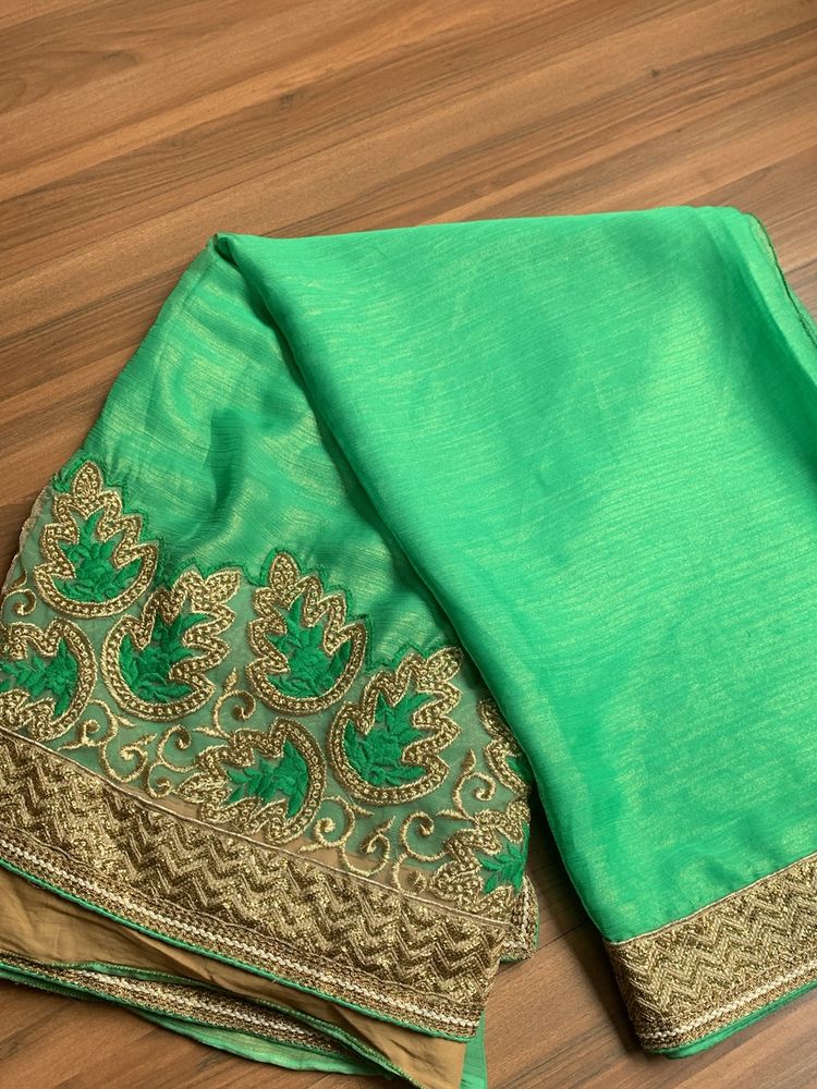 A Pretty Party Wear Saree With Blouse.