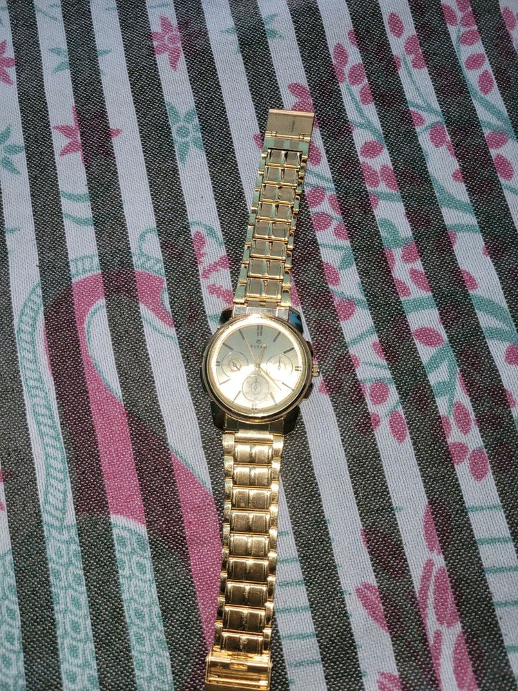 Titan Watch Good Condition golden Colour