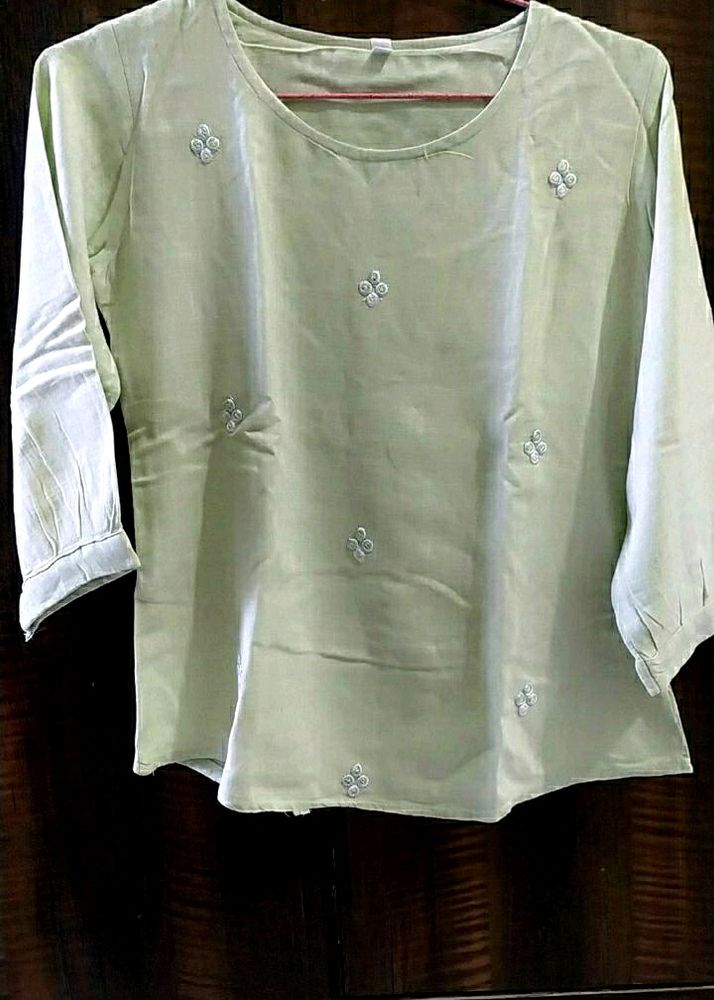 A Light Green Top  In  Large Size