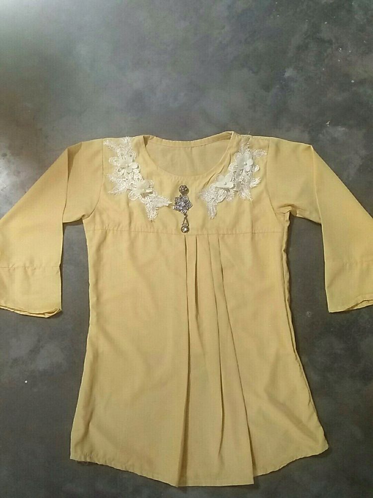 A Light Faded Yellow Pretty Top