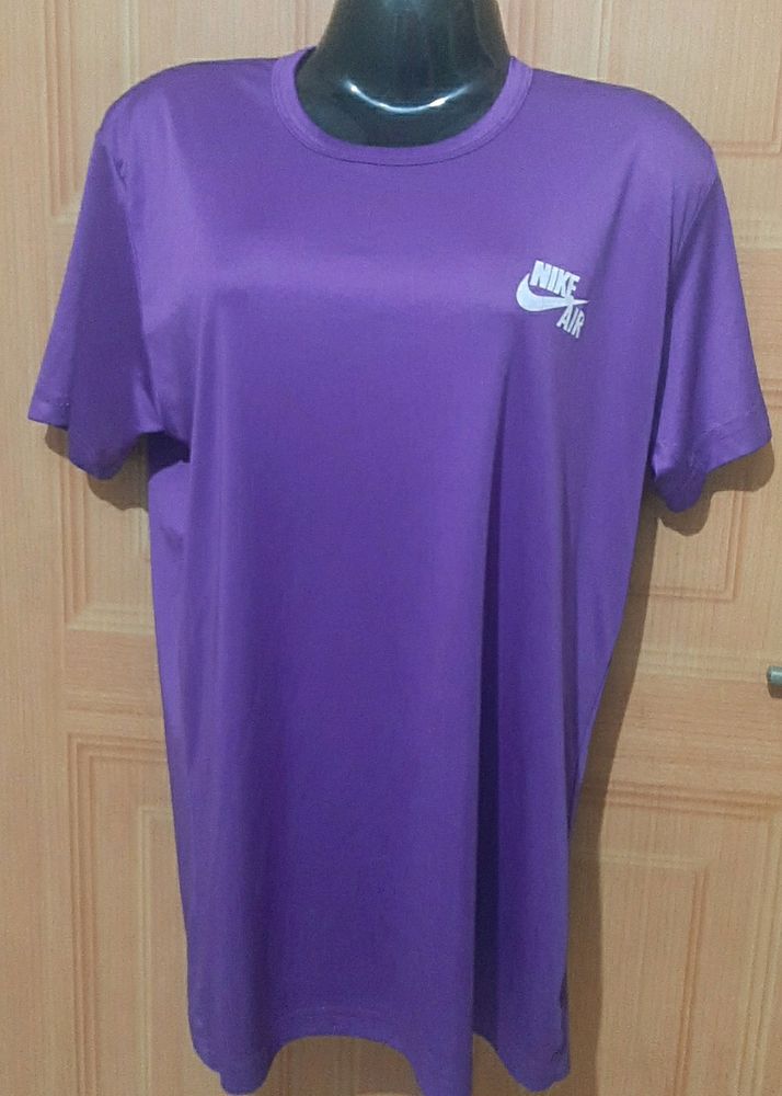 NIKE AIR PURPLE ACTIVE WEAR TSHIRT.