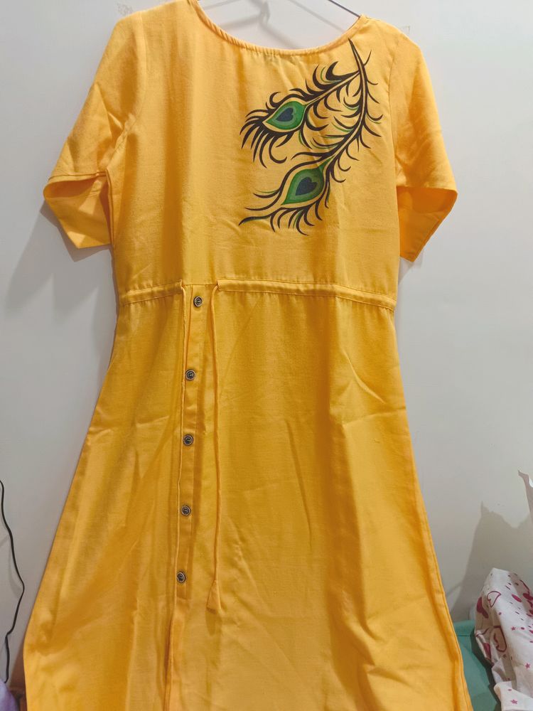 Yellow Morpankh Print Kurti With Tie Knots At Wais