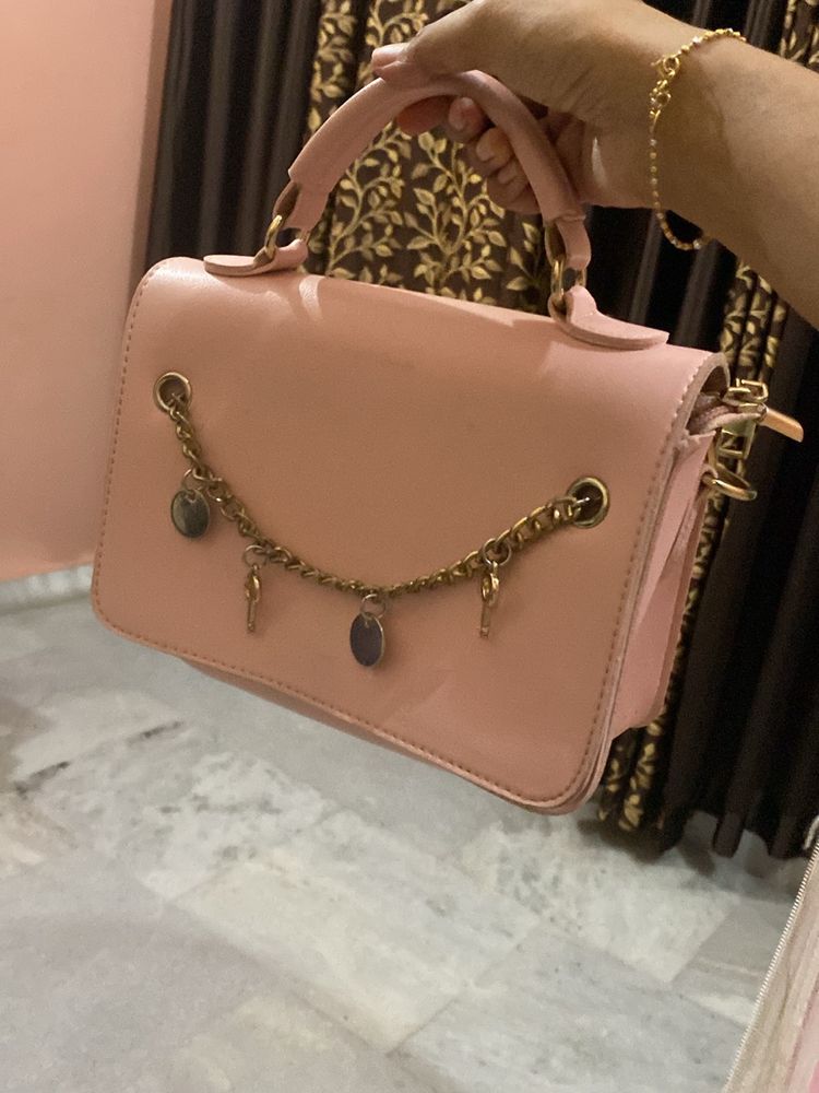 Baby pink sling bag.