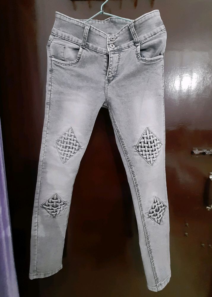 women grey mid rise jeans with beautiful check det