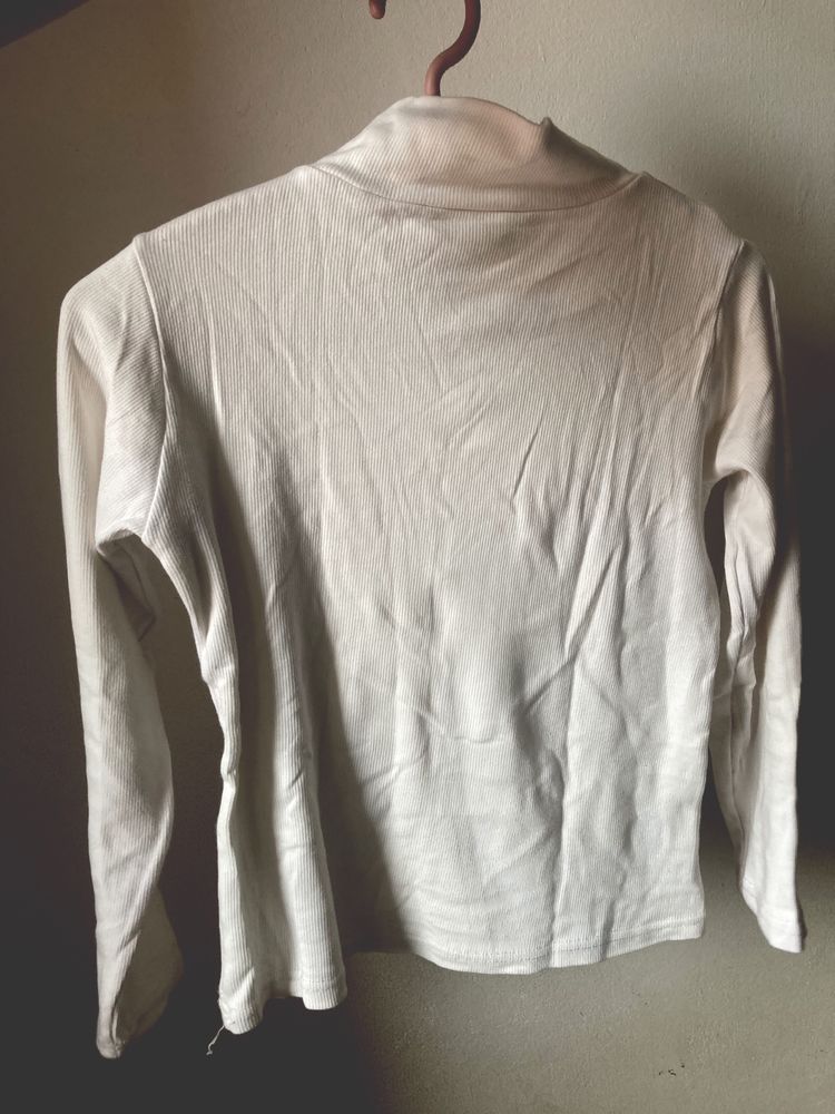 White women's turtleneck.