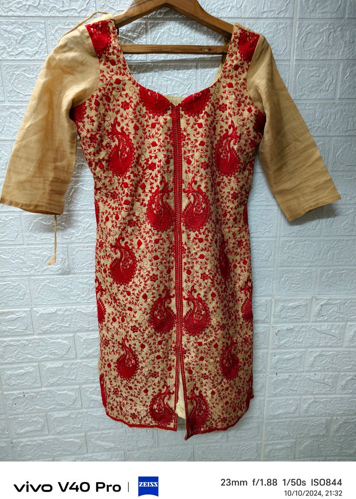 Golden Glamour: Festive Kurta Adorned with Rich Re