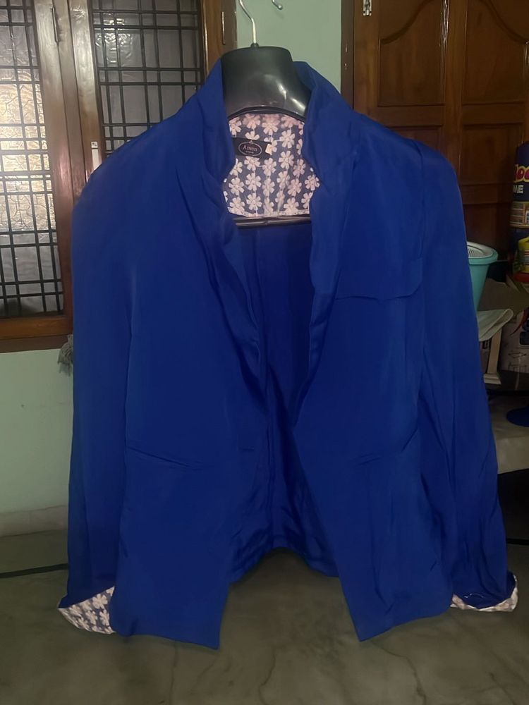 A blue office wear Jacket or  coat