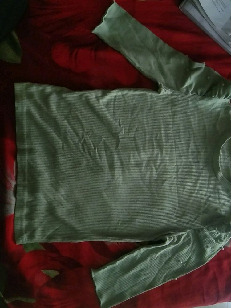 I'm Selling a Girls Top Of Light Green With Pearls