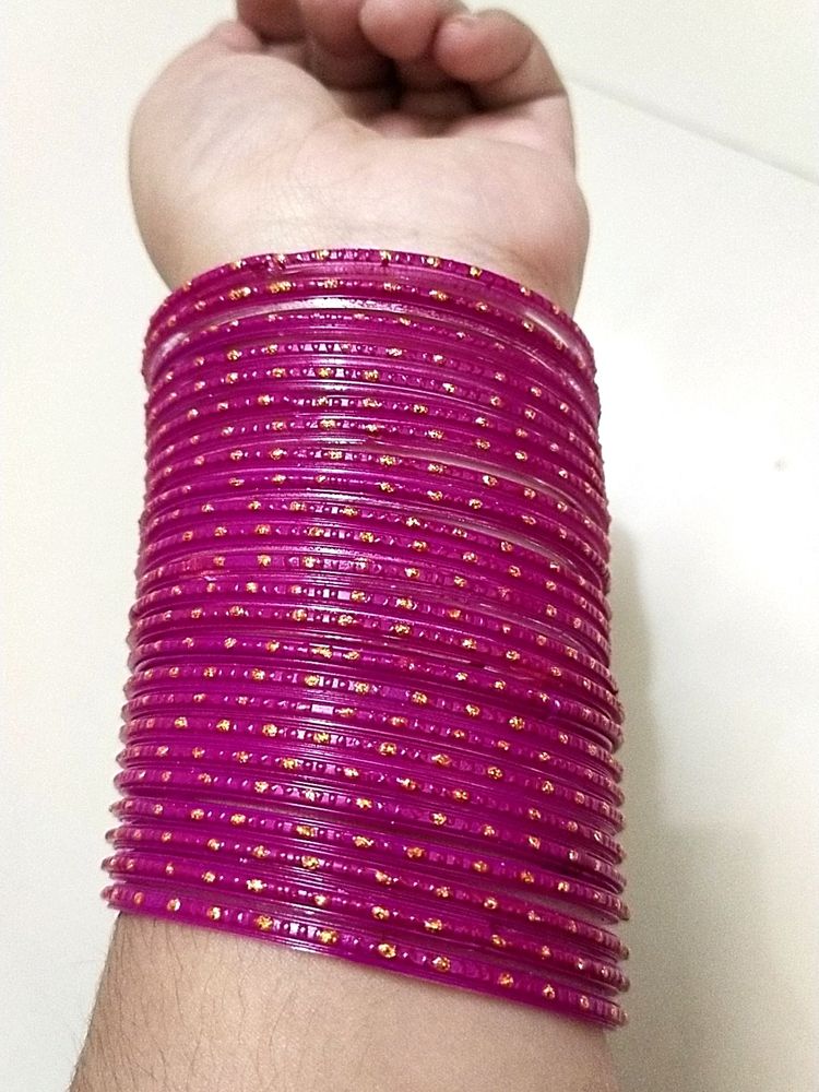 A Beautiful Rani Pink Colour Bangles With Golden