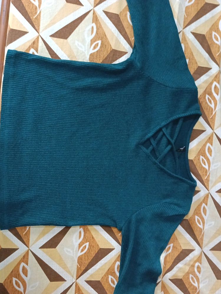 I am Selling A Dark Green Top .