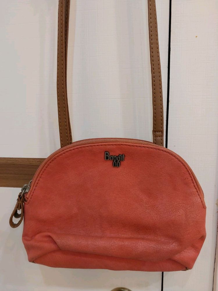 Baggit Leather sling Bag Coral Color With 2 Compar