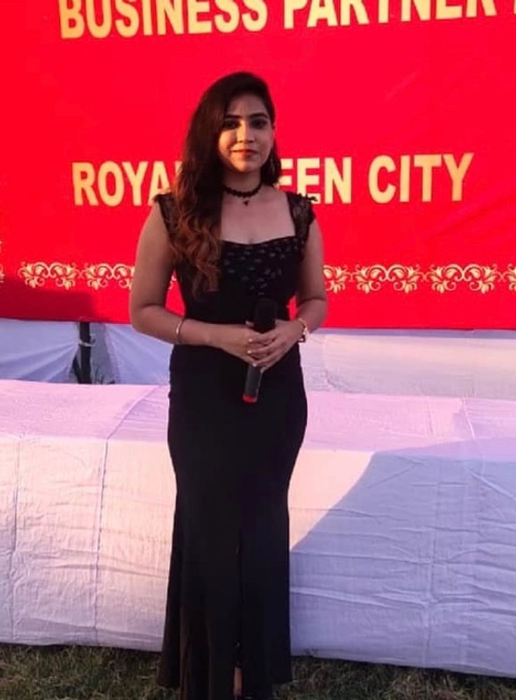 The black slit gown is embedded with black stone in front neck..  The condition of the dress is really good but ..some stones have got seperated from the neck.. Its beautiful to wear to any party