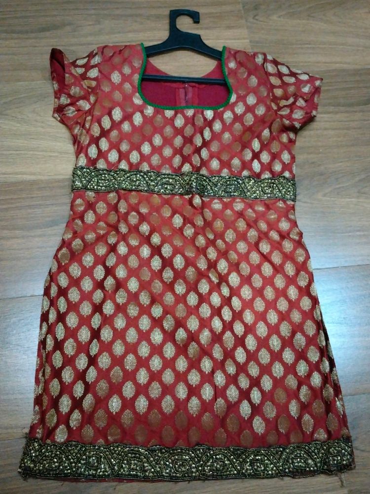 Lovely Kurti In Red Colour With Golden Butti