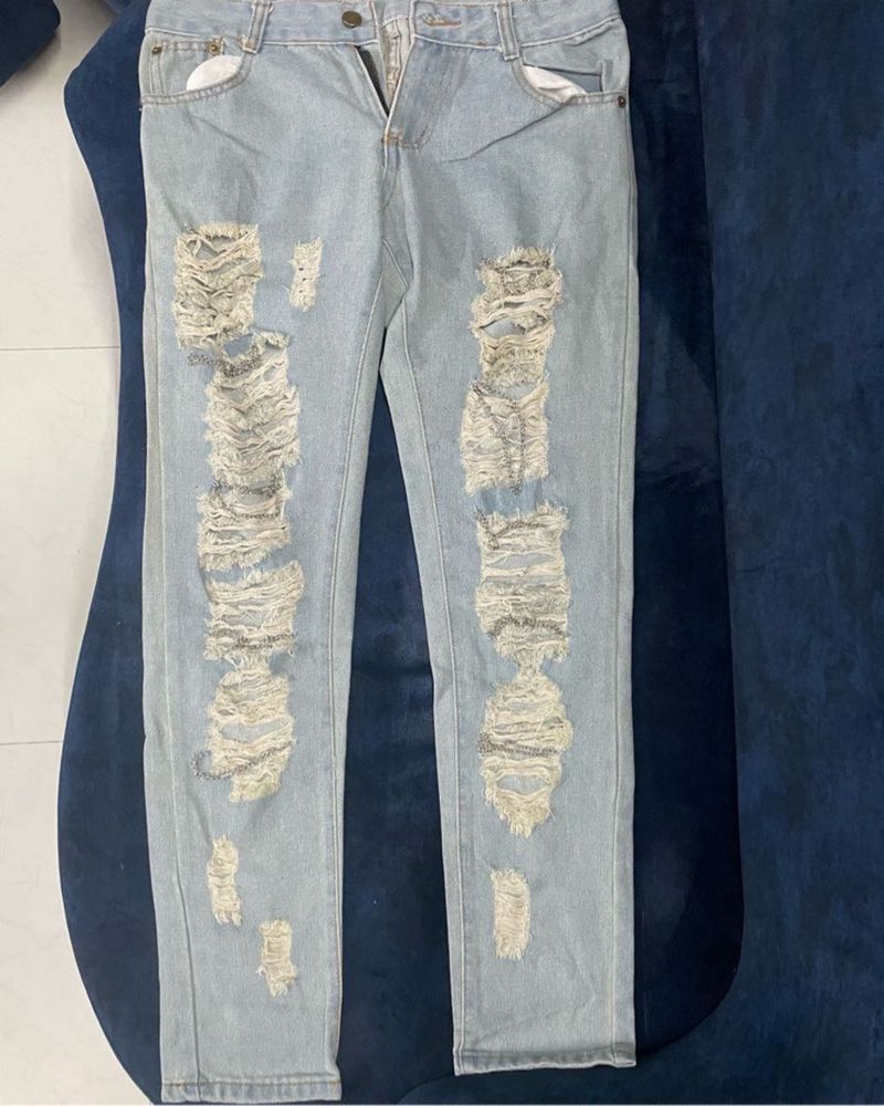 Distressed Jeans With Chain Detail