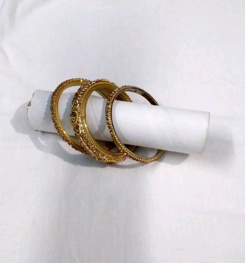 Set Of Three Bangles In Golden Color