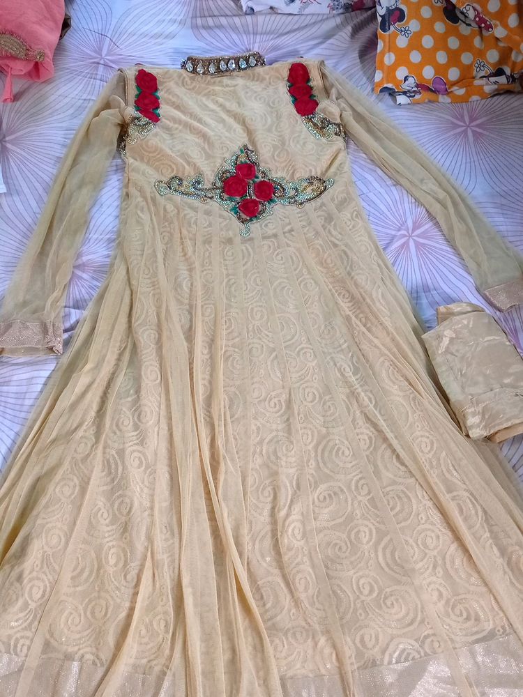 yellow gown suit with yellow pant and yellow net dupatta