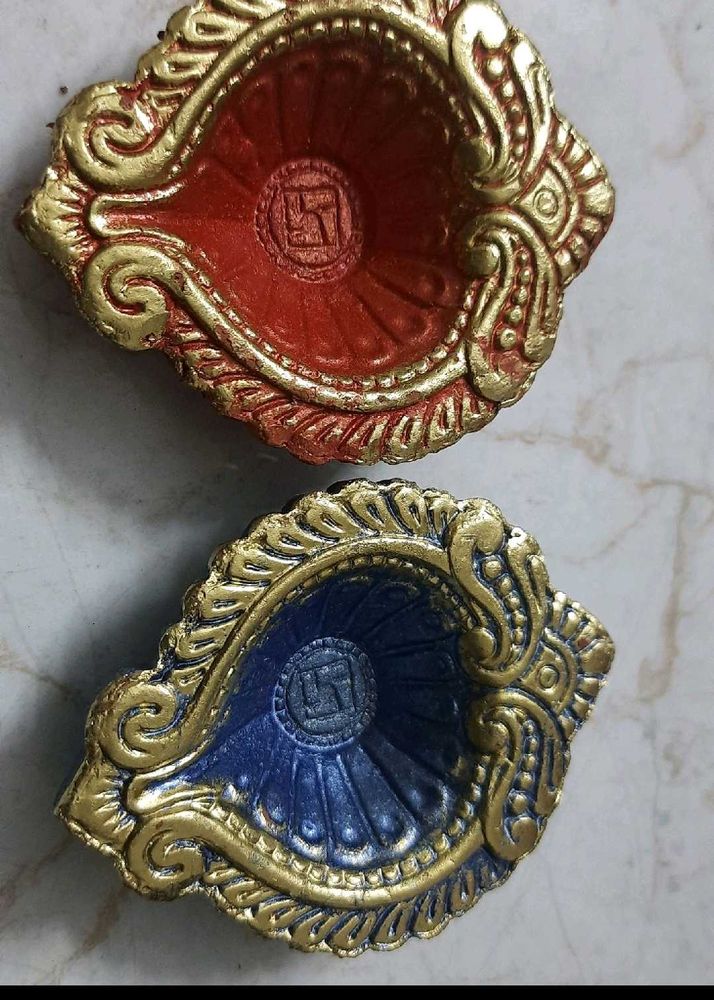 Diyas painted red ,blue ,gold,good for Diwali