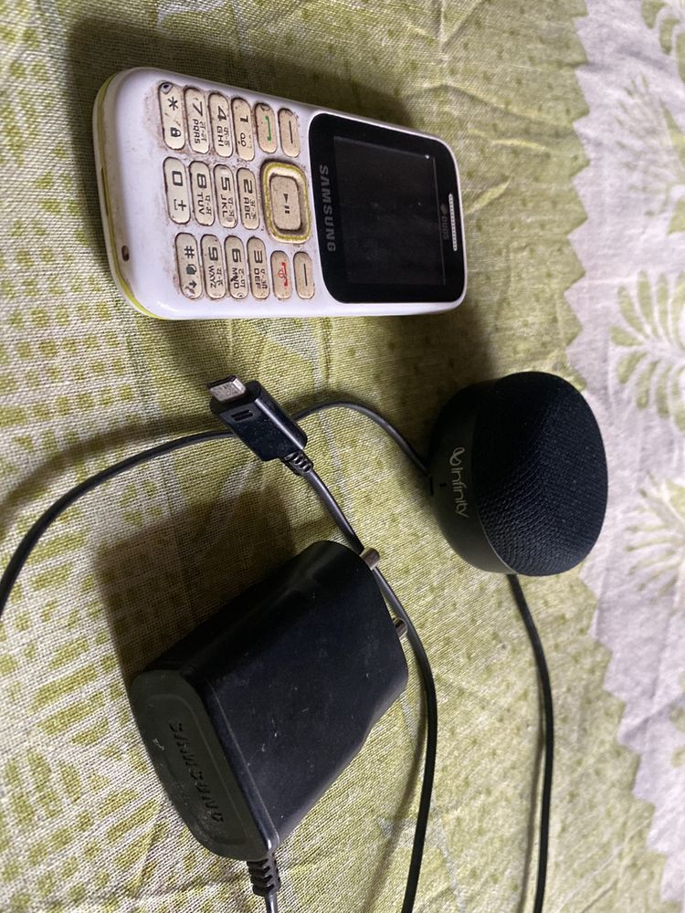 Phone , Charger And Speaker