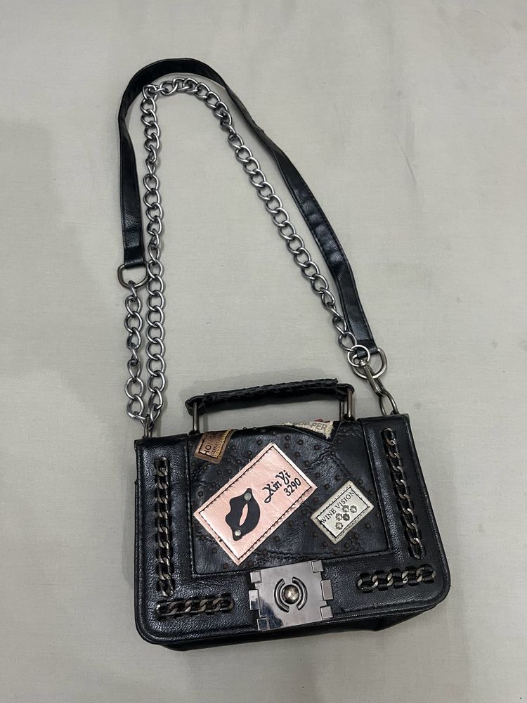 Punched Black Sling Bag.