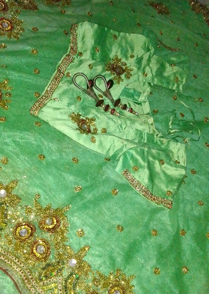 Net Saree With Blouse In Green Colour