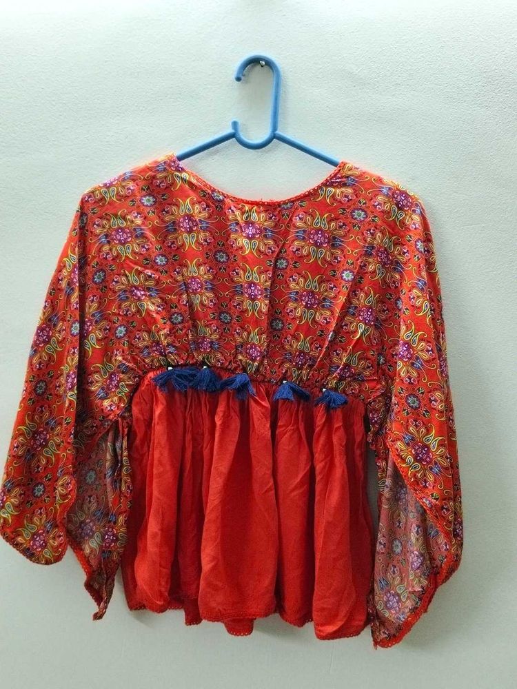 Printed Orange Top With Cut-out Cape Sleeves