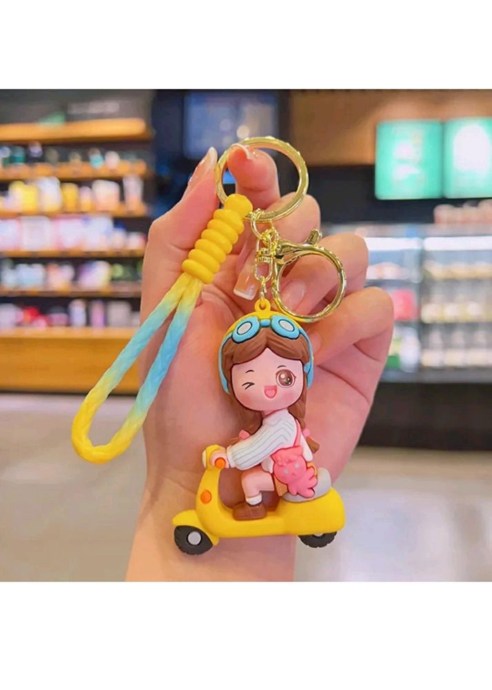 YELLOW SCOOTY GIRL KEYCHAIN