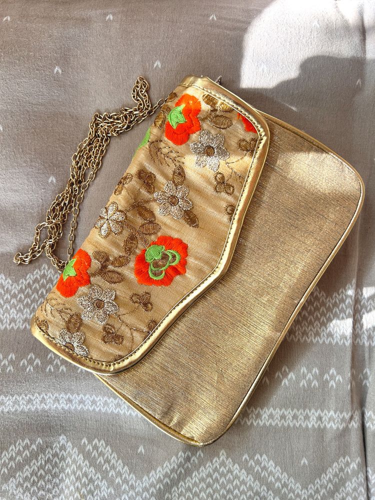 A Embroidered Sling Bag Golden In Color