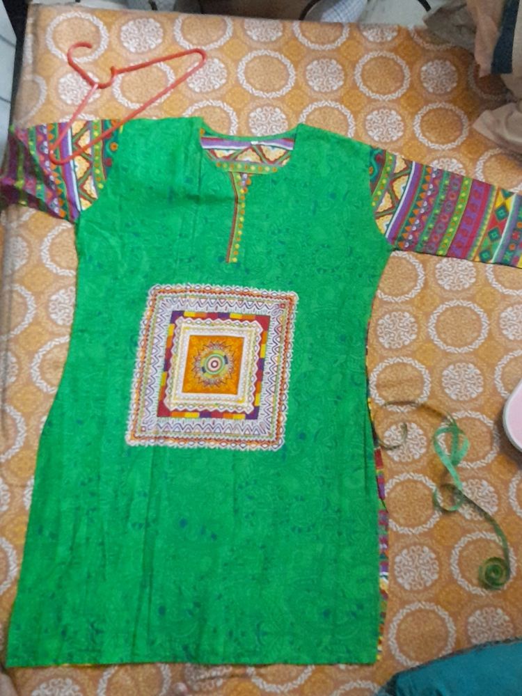 Beautiful Rayon kurti...front is green and back is multicoloured...totally new ...no flaws....not used single time...three quarters sleeves...side cut