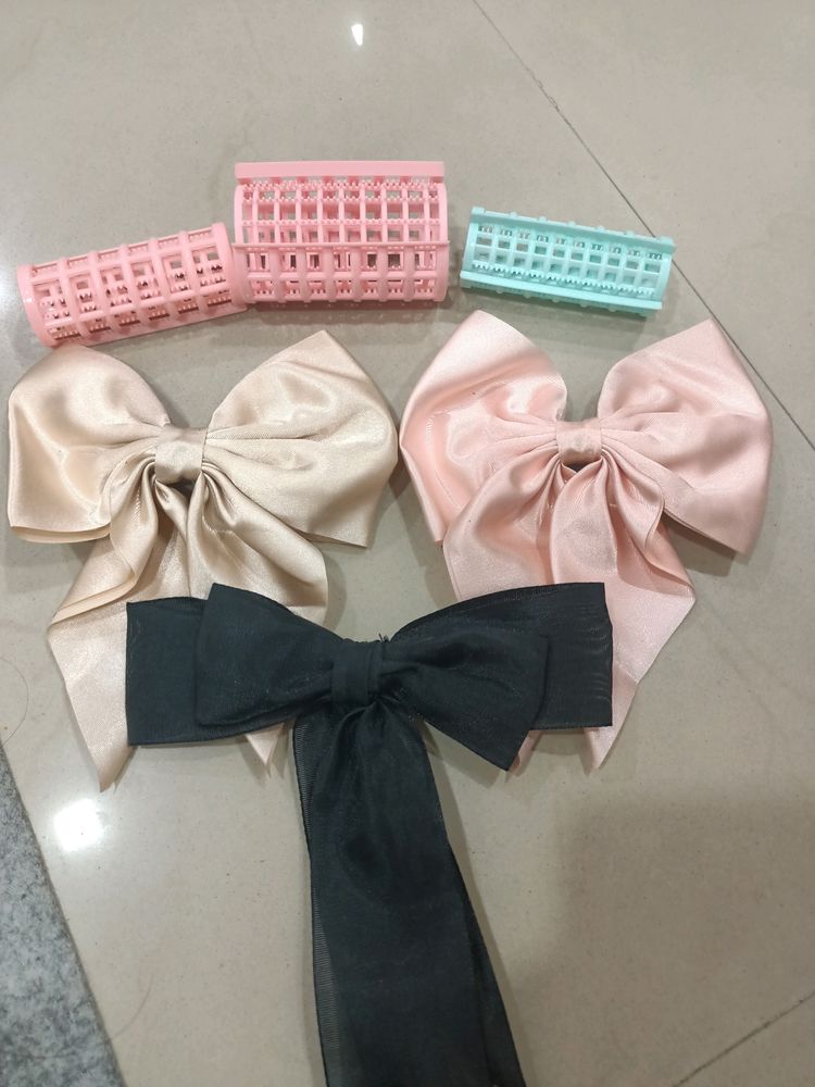 combo of 3 bows and hair rollers