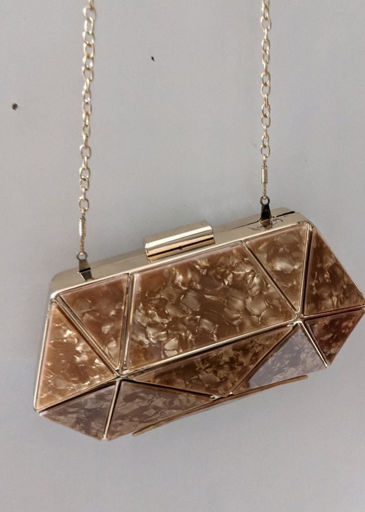 Golden brown diamond shape clucth