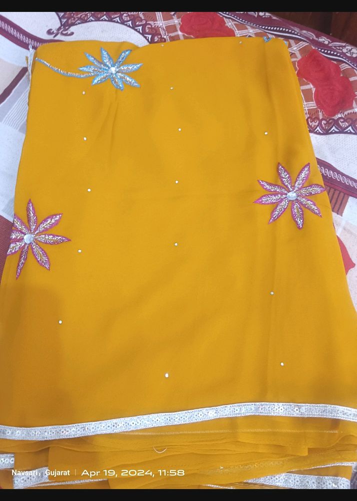 A Gold Yellow Saree With Beautiful Print